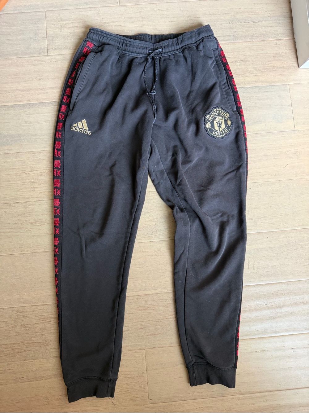 adidas Black Men's Joggers with Red Side Trim and Manchester United Crest